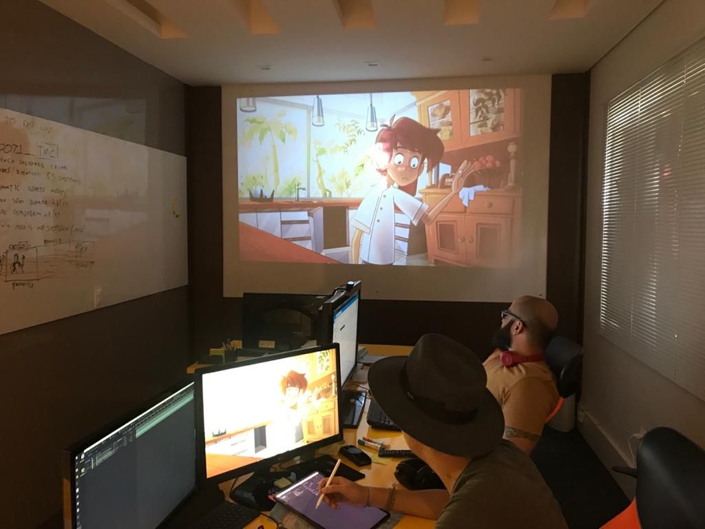 A equipe reunida para revisar uma sequência de Chef Jack projetada